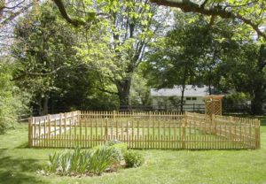 Before this garden could get started, we encased it in a custom 4' cedar spindle fence.