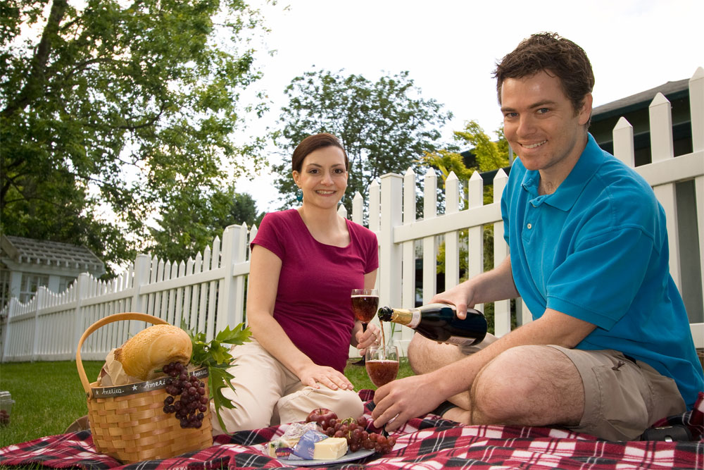 couple in front of a fence